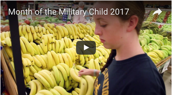 Screenshot of the Month of the Military Child video. A child stands in front of bananas in the 