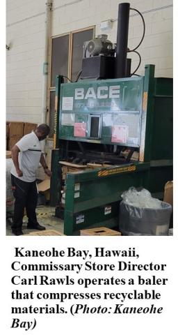 Worker uses baler